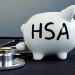 A piggy bank with HSA initials on it